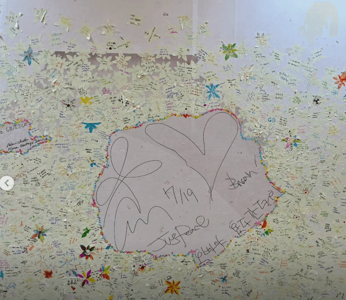 JUSPEACE message wall of paper flowers